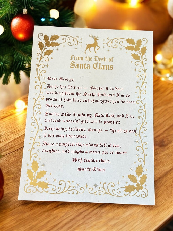 Luxury handwritten Santa letter with gold foil and Christmas tree lights