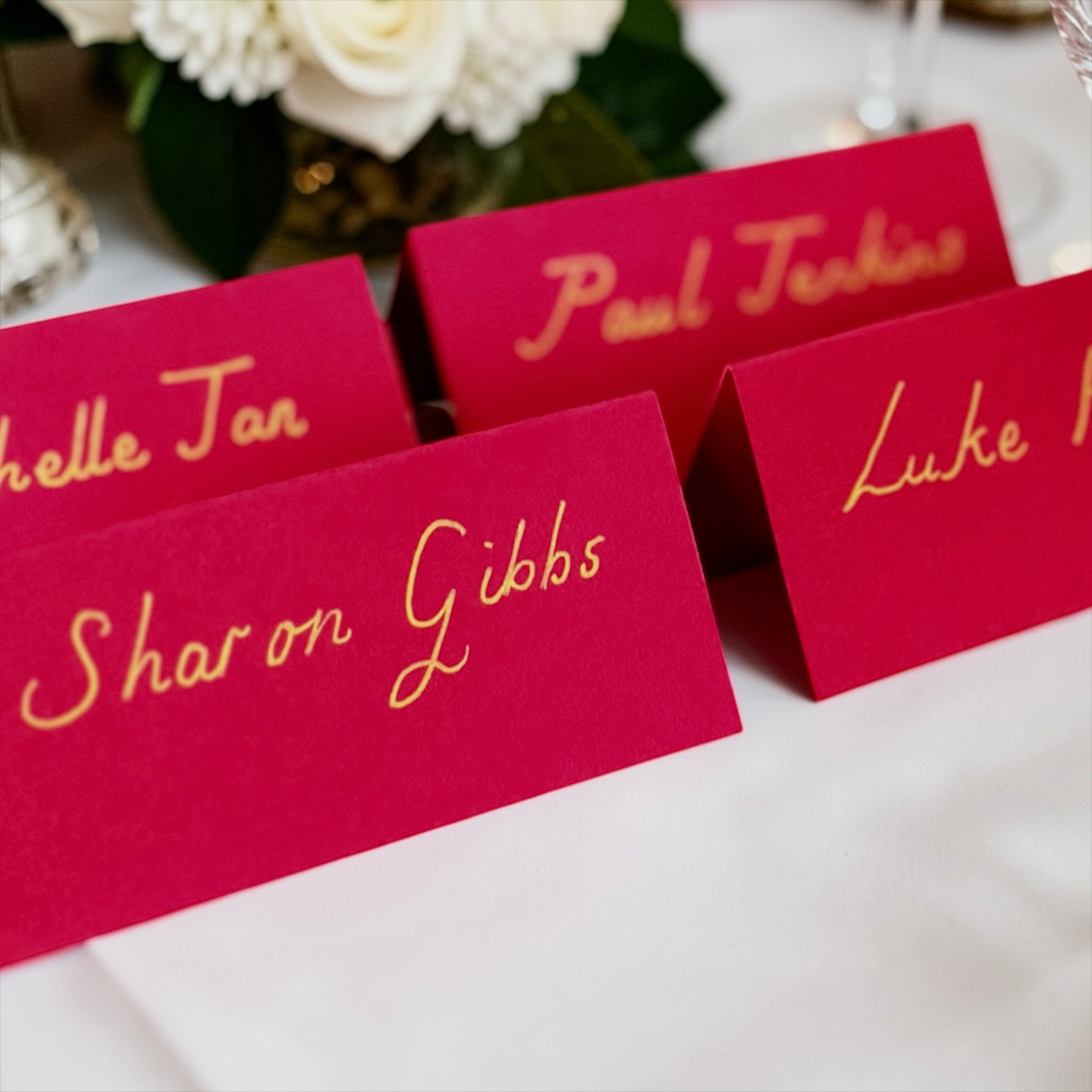 Handwritten Red Place Cards with Gold Ink