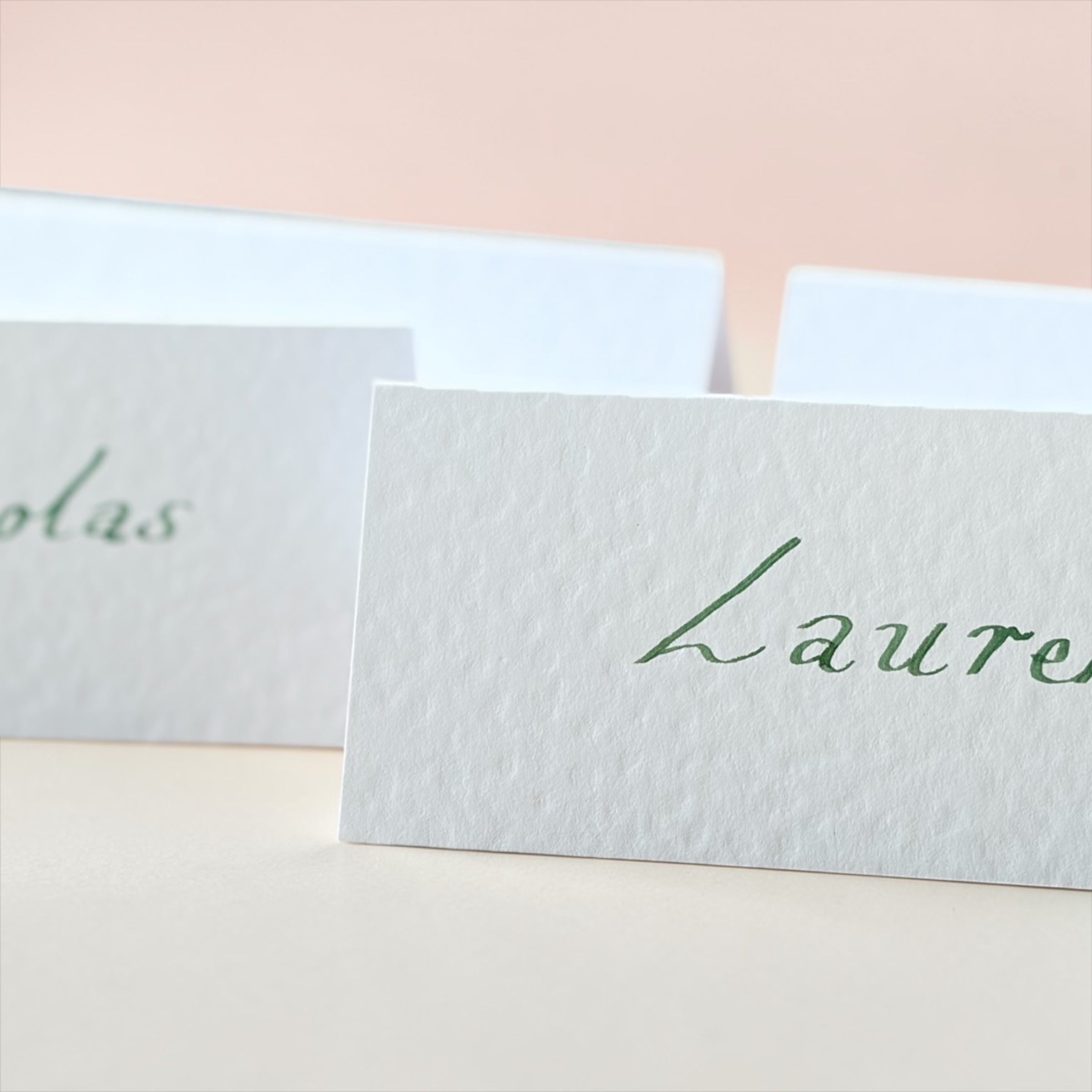 Handwritten White Wedding Place Cards: Emerald Green Ink Cursive