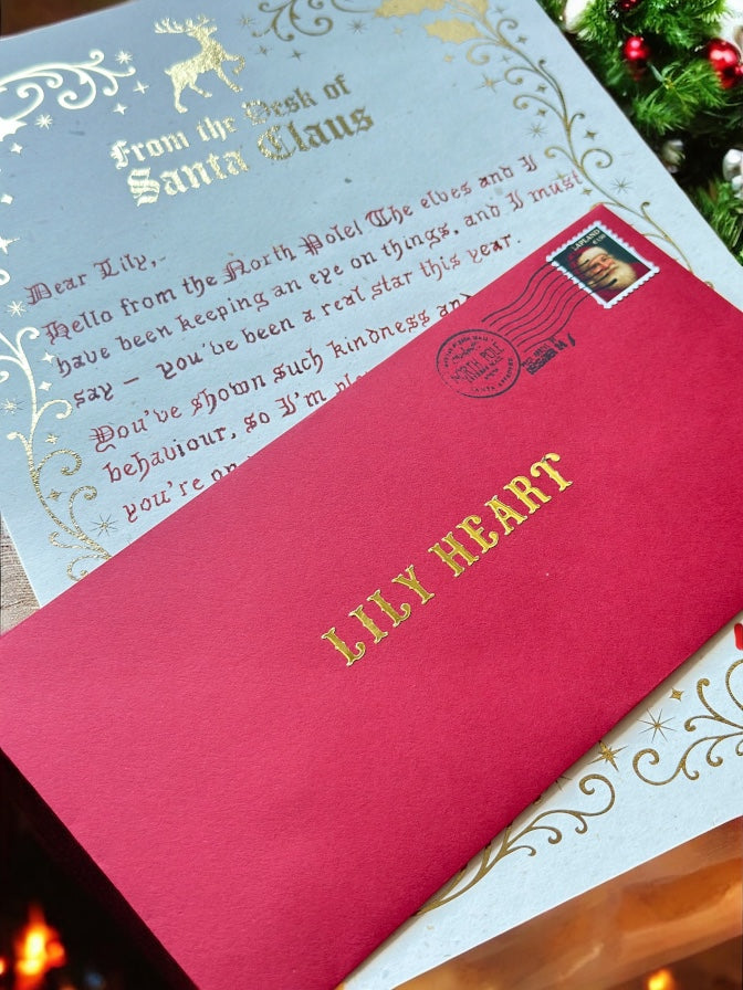 Luxury handwritten Santa letter with red envelope and gold-foiled name from Father Christmas